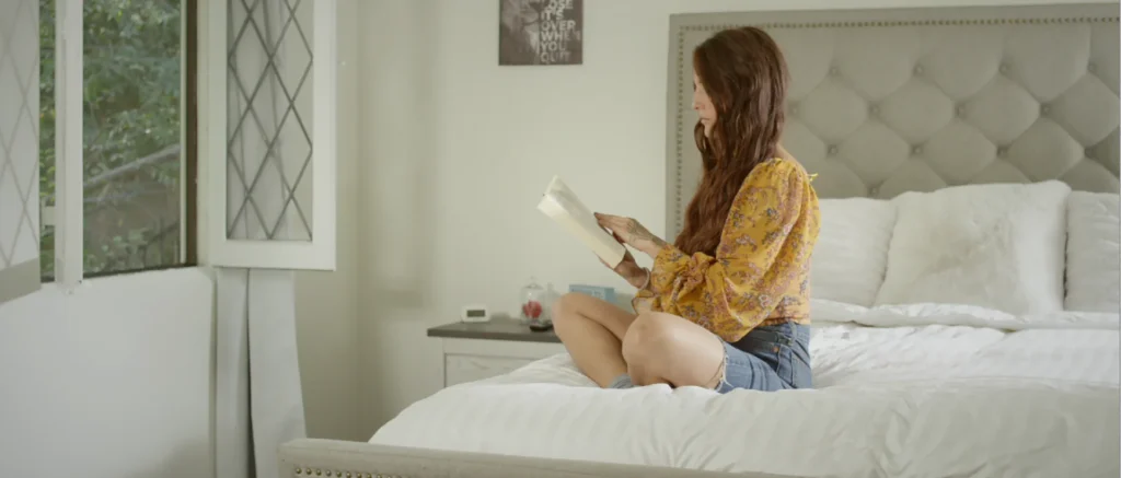 girl on bed reading book
