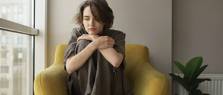 sad woman sitting down