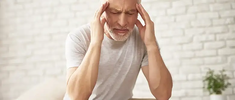 old person with headache