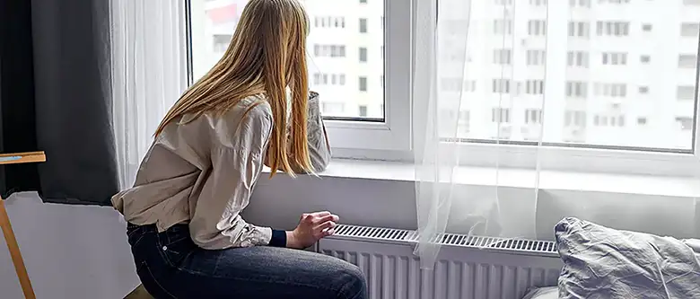 woman sitting by the window during recovery
